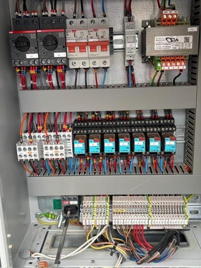 Industrial electrical control panel with circuit breakers and wiring